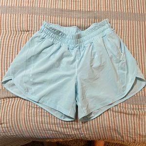 Like new Lululemon TRACK THAT SHORT 5" blue glow size 8